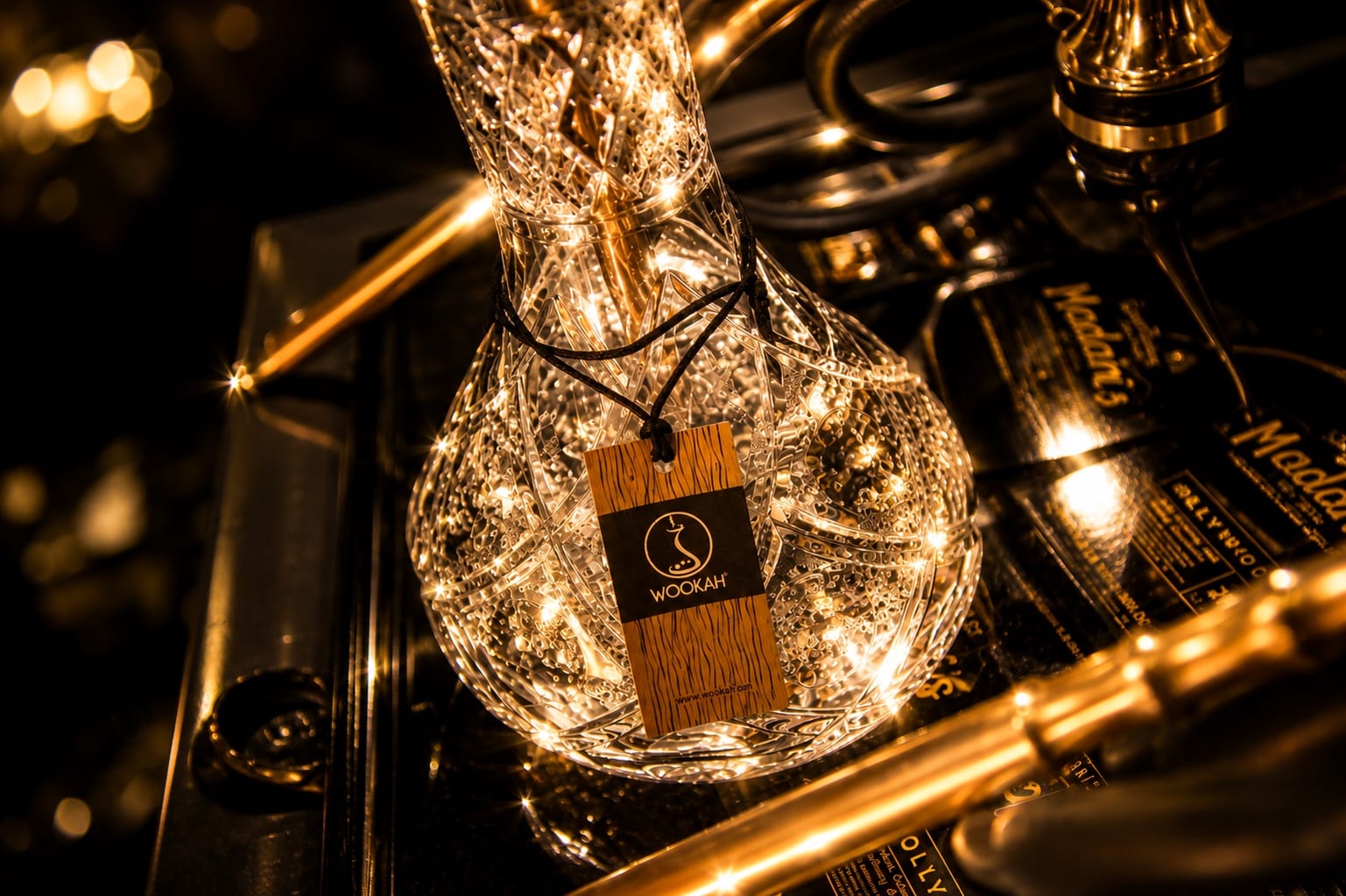 Crystal hookah base glowing under warm light